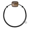 BRACELET CORDON NOIR COUSSIN OEIL DE TIGRE MIEL